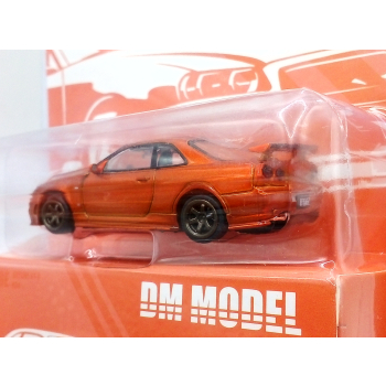 Nissan Skyline GT-R R34 orange - skala 1:64 - DM Model